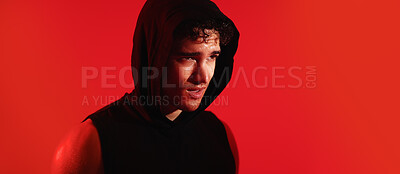 Buy stock photo Fitness, man and sweating on studio with exercise break, thinking and training recovery for wellness. Mockup space, tired person and athlete with workout rest, hoodie and banner on red background.