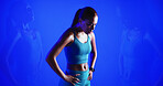 Fitness, break and woman in studio with double exposure for workout, training or wellness. Sports, breathing and female athlete sweating for exercise, practice or challenge by blue background.