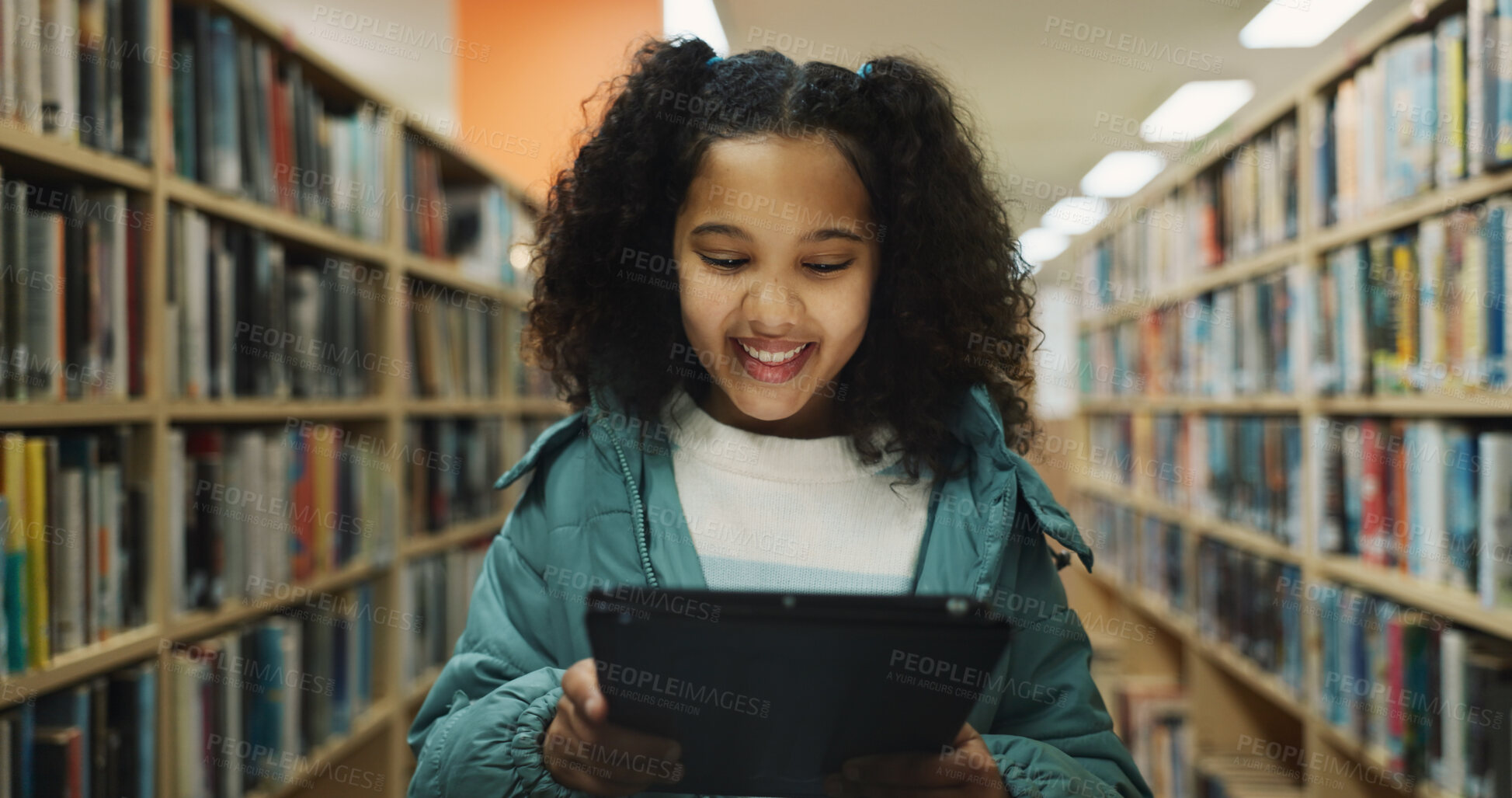 Buy stock photo Girl, child and learning in library with tablet, ebook website or online literature for development. Happy, student and reading at school with tech, storytelling app or education for knowledge growth