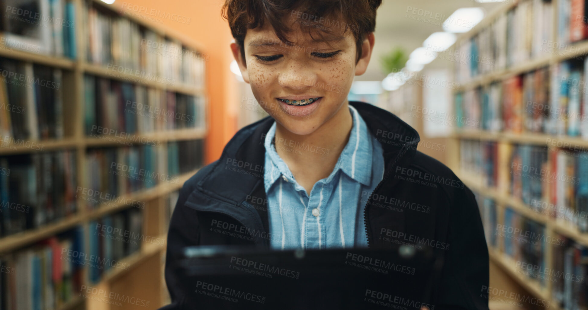Buy stock photo Education, student and tablet with boy in library for back to school development, growth or study. App, learning and reading with child learner at academy for future, knowledge or online research