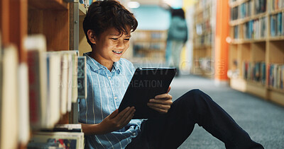 Buy stock photo Learning, student and tablet with boy in library for back to school development, growth or study. App, education and reading with child learner at academy for future, knowledge or online research