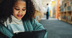 Girl, child and browsing in library with tablet, ebook website and online literature for development. Kid, student and reading at school with tech, storytelling app and education for knowledge growth