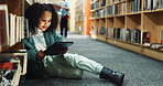 Girl, kid and browsing in library with tablet, ebook website and online literature for development. Child, student and reading at school with tech, storytelling app and education for knowledge growth
