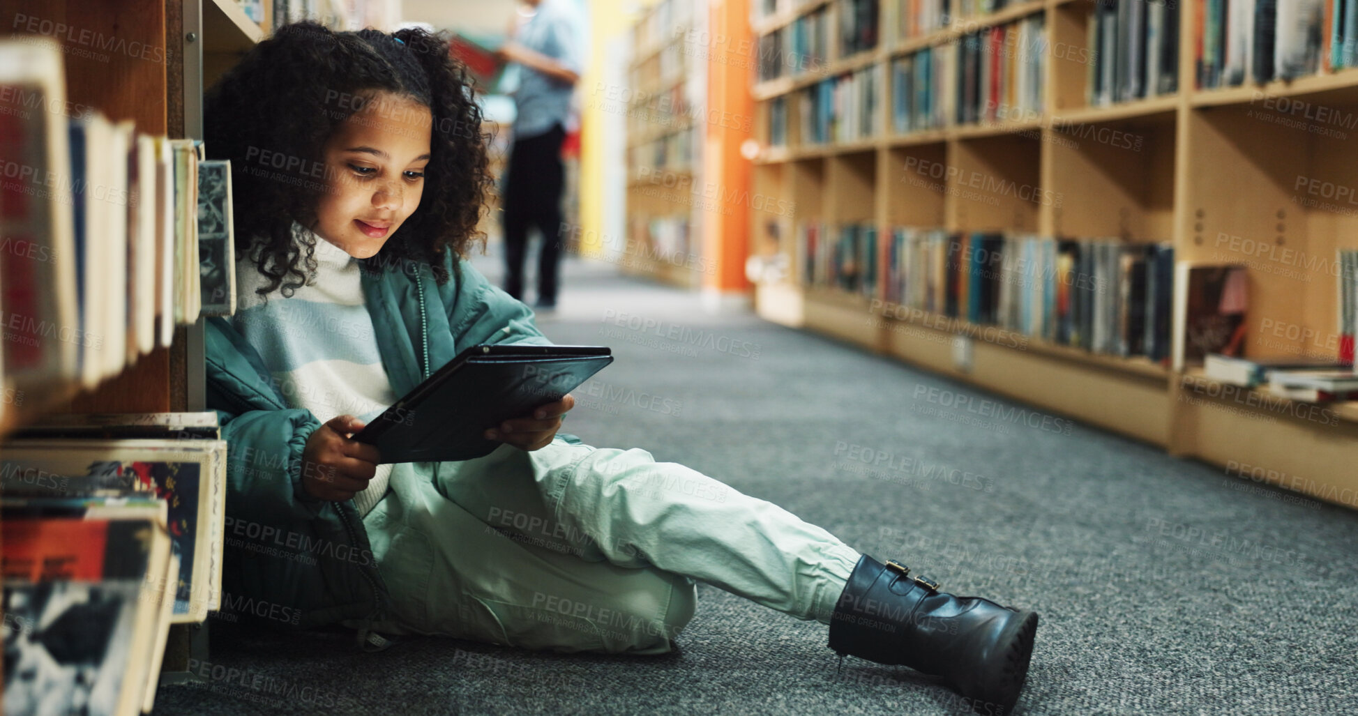 Buy stock photo Girl, kid and browsing in library with tablet, ebook website and online literature for development. Child, student and reading at school with tech, storytelling app and education for knowledge growth