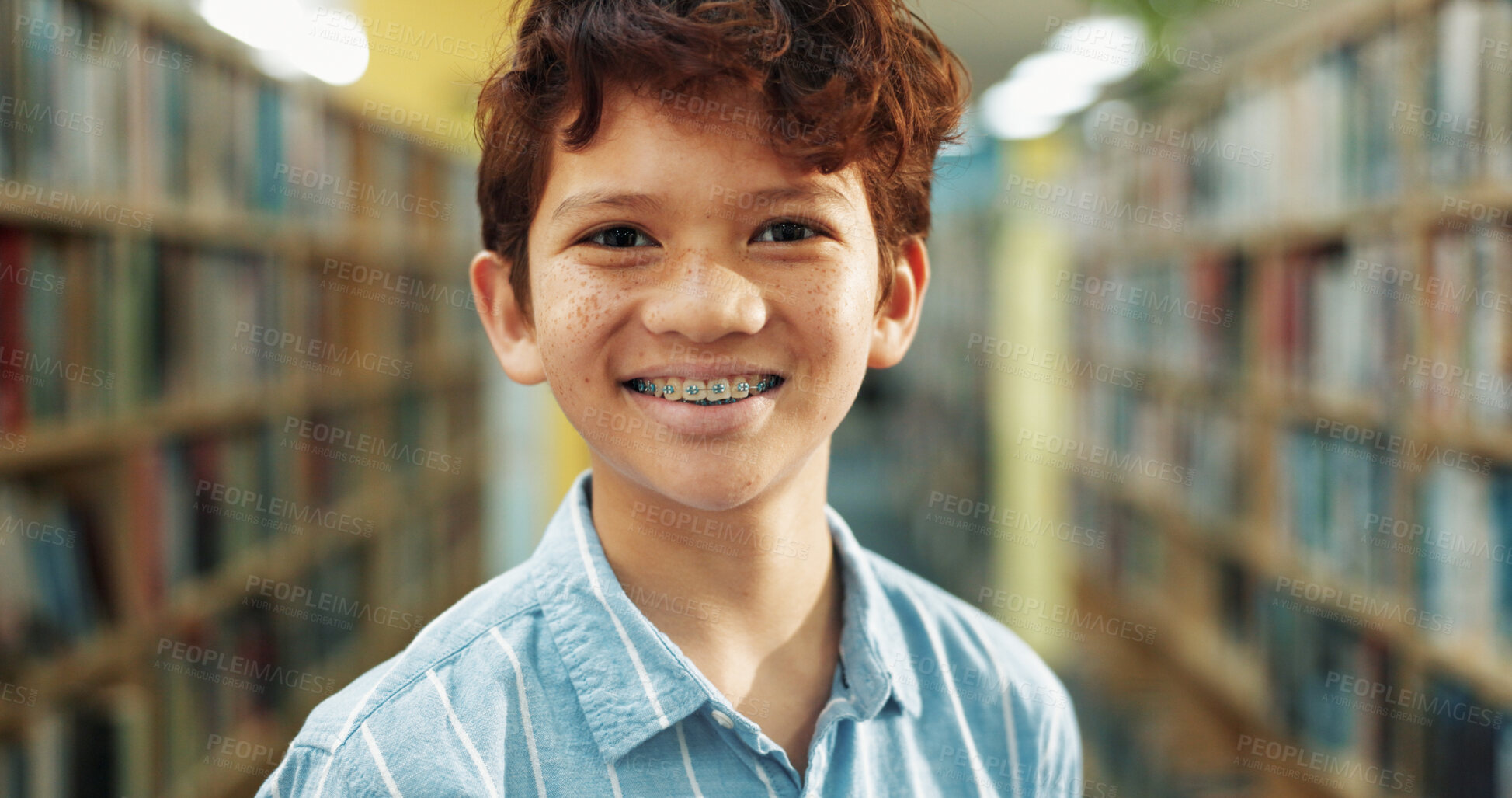 Buy stock photo Portrait, education and boy in library, smile and knowledge for child development. Student, braces and kid in school, learning and study for scholarship, books and information literacy for growth