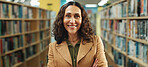 Education, portrait or teacher in library with arms crossed, job or confidence in academic position. Happy, mature woman or educator at school with literature, career or about us in tutoring industry