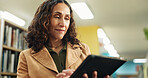 Library, teacher and woman with tablet for education, reading and planning for curriculum on website. University, professor and mature person with tech for lesson preparation, knowledge and online