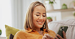 Woman, phone and smile in home with social media, communication and networking in living room. Gossip, female person and reading with digital tech for online chatting, texting or mobile app in house