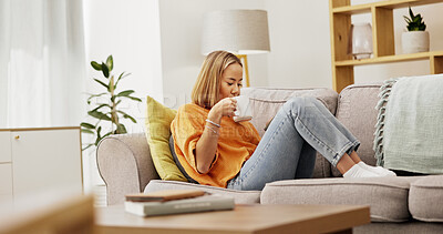 Buy stock photo Drinking, coffee and woman with smartphone on sofa, communication or reading message on social media. Texting, home and person with mobile for digital chat, online and relax with tea in living room