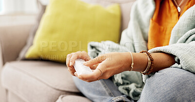 Buy stock photo Sick, pills and hands of woman on sofa in home with supplements, vitamins or medicine. Pharmaceutical, relax and female person with medication box for wellness, recovery or health in living room.
