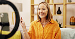 Live streaming, ring light and smile with woman in home for influencer, promotion or presenting. Virtual tutorial, content creator and filming online review with person and phone for vlog broadcast