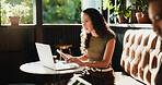 Laptop, phone and woman in coffee shop with freelance career for cafeteria review on dining blog. Technology, cellphone and restaurant critic with computer for online article with diner website.