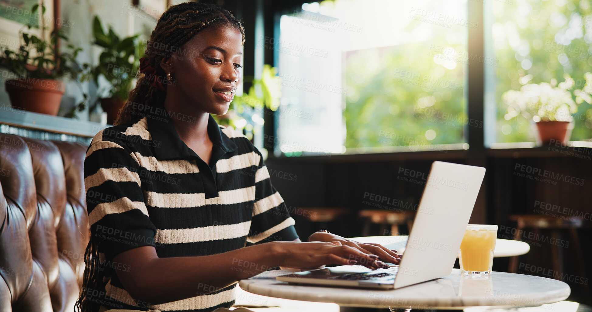 Buy stock photo Typing, online and happy woman with laptop in cafe, blog and freelance project on web or ad campaign. Copywriting, smile and black person with technology for article, remote work and creative in shop