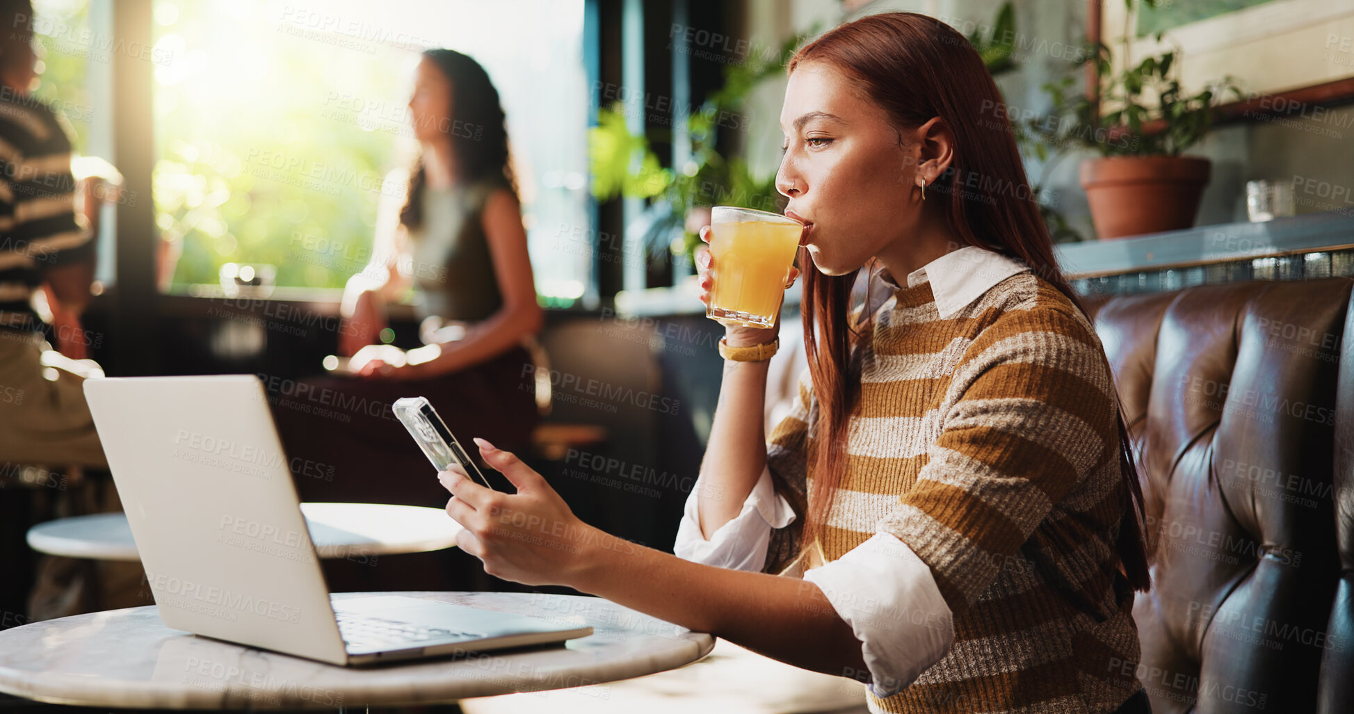 Buy stock photo Woman, phone and drink in cafe for remote work, trend research and conversation. Freelance person, laptop and texting in coffee shop for project, communication or social networking in small business