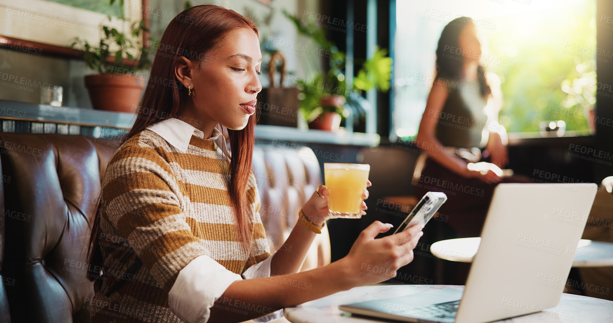 Buy stock photo Remote work, phone and woman in cafe, internet for social media and online submission. Orange juice, person and journalist in restaurant, pc and digital app for magazine subscription and network