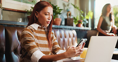 Buy stock photo Woman, phone and laptop in restaurant with remote work, email and social media marketing notification. Freelancer, person and typing in cafe with tech, mobile app and website for online advertising.