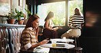 Woman, phone and break in cafe for remote work, trend research and conversation. Freelance person, laptop and texting in coffee shop for project, communication or social networking in small business