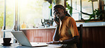 Black woman, phone call and laptop in coffee shop for conversation, trend research and remote work. Person, tech and freelancer in cafe for project, communication or networking in small business