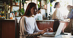 Woman, freelancer and journalism with laptop in cafe for network, internet access or research. Female person, journalist or remote work with computer in coffee shop for online article or magazine