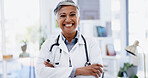 Portrait, happy woman and doctor with arms crossed in hospital, medicine and pride for career growth. Medical professional, smile and confident for healthcare service, help or mature person in clinic