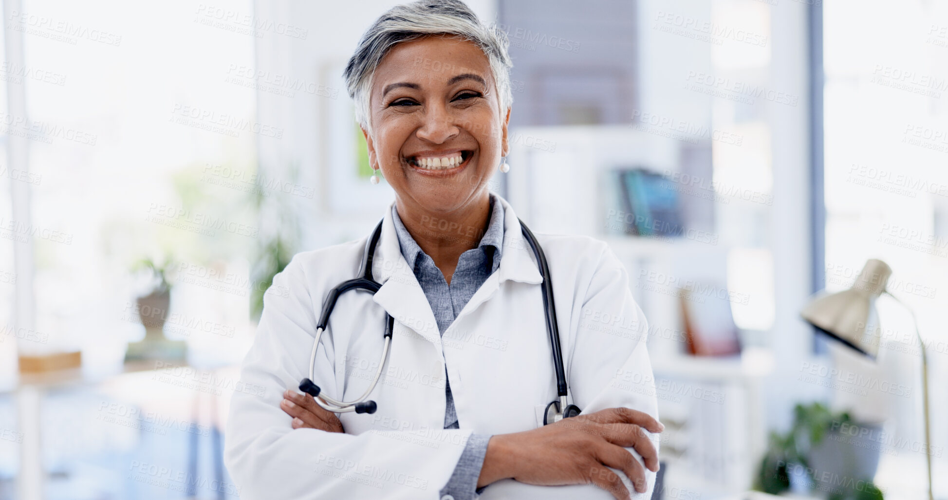 Buy stock photo Portrait, happy woman and doctor with arms crossed in hospital, medicine and pride for career growth. Medical professional, smile and confident for healthcare service, help or mature person in clinic