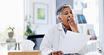Doctor, paperwork and woman with yawn at office for admin, fatigue and exhausted with medical job. Mature person, tired and documents for healthcare report, review and feedback with burnout at clinic