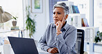Woman, laptop and stress in office with thinking, mistake and confused with project at insurance company. Mature person, broker or frustrated with pc, glitch or risk management services at agency