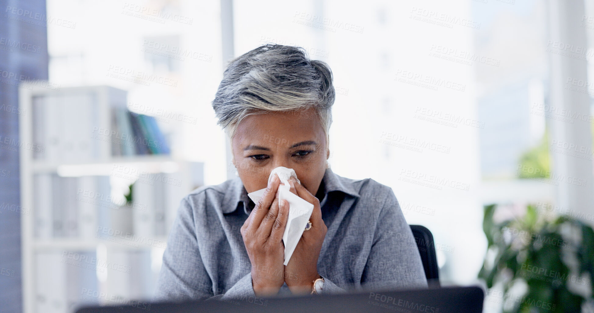 Buy stock photo Illness, tissue and businesswoman blowing nose in office with  cold, flu or sinus infection. Sick, virus and mature female person with toilet paper for sneeze with allergies or hayfever in workplace.