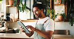 Typing, tablet and man in cafe, internet or service for online order, hospitality or startup website. Barista, entrepreneur or person in restaurant, tech for inventory or planning menu to check price