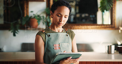 Buy stock photo Hospitality, tablet and woman in cafe, internet and service for online order, email and startup website. Barista, entrepreneur or person in restaurant, tech for inventory or planning menu with apron