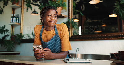 Buy stock photo Phone, small business and thinking with black woman in coffee shop for decision or planning. App, inspiration and vision with African waitress in restaurant cafe for communication or feedback