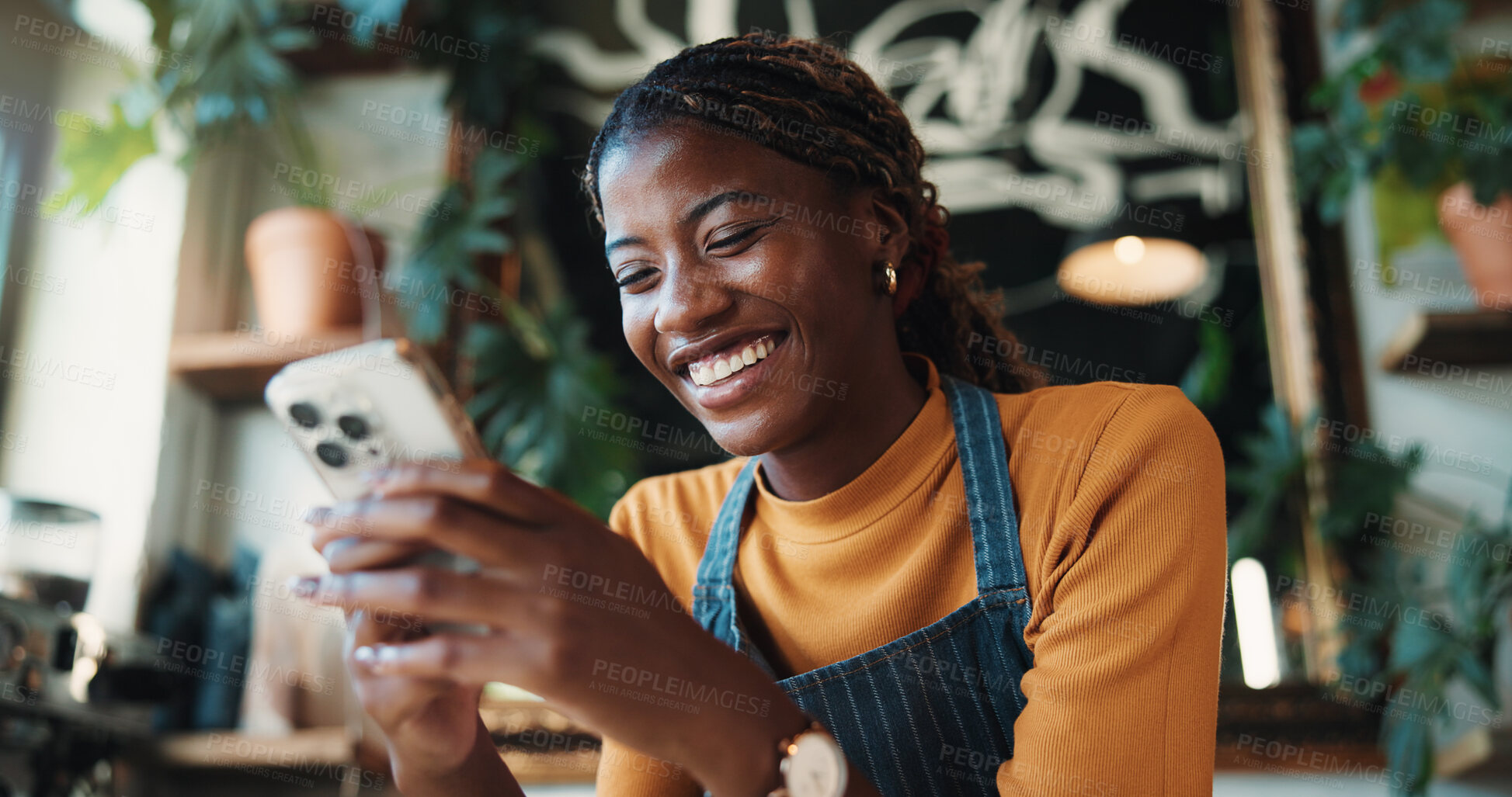 Buy stock photo Happy, waitress and woman in cafe with phone, typing text message or notification for online order. Black person, smile and browse in restaurant with tech, social media or mobile app for hospitality.