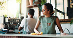 Woman, barista or cleaning counter with cloth in cafe for small business, hygiene or disinfection. Female person, employee or wiping surface for dirt, bacteria or germ removal in coffee shop or store