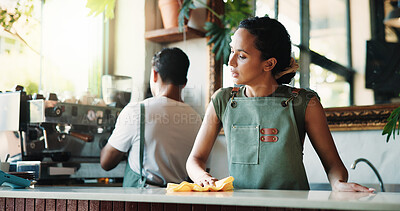 Buy stock photo Woman, barista or cleaning counter with cloth in cafe for small business, hygiene or disinfection. Female person, employee or wiping surface for dirt, bacteria or germ removal in coffee shop or store