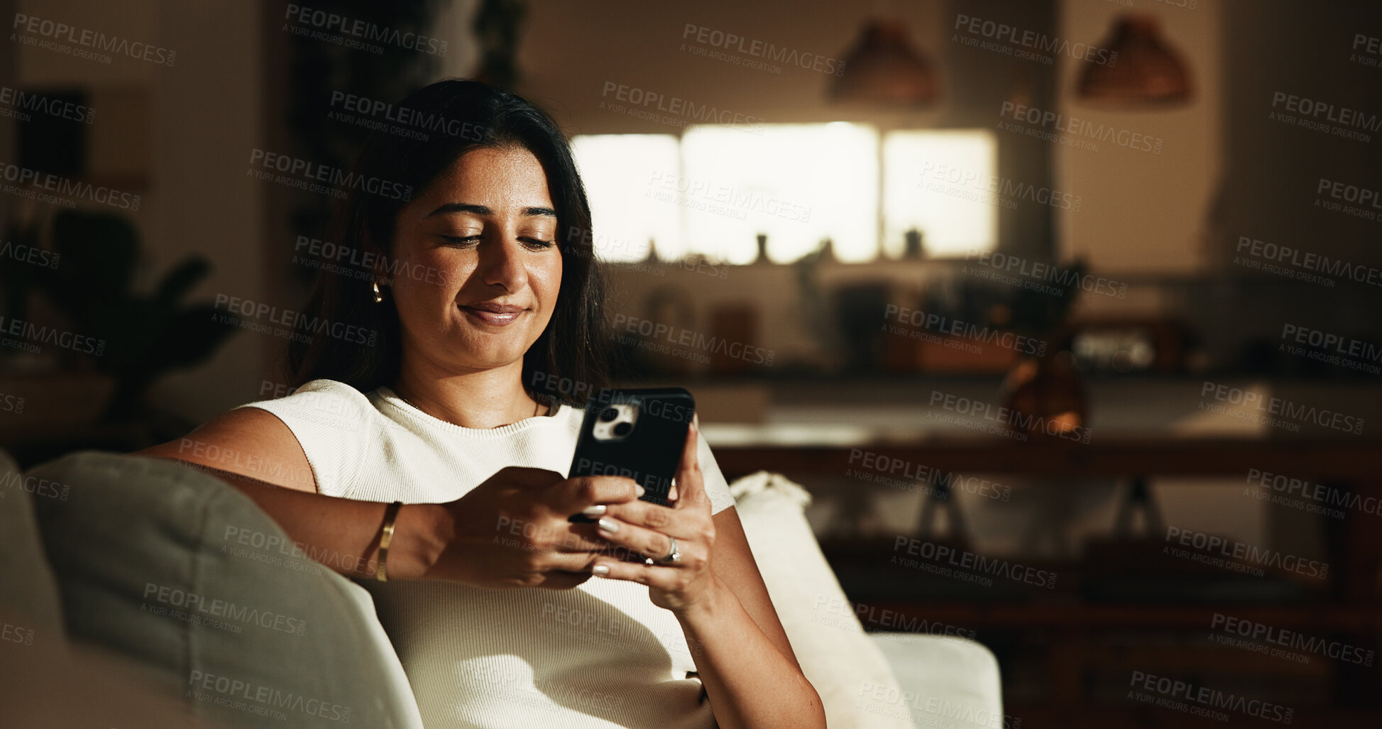 Buy stock photo Smile, reading and phone with woman on sofa in home for communication, social media and relax. Contact, online chat and connection with person and mobile in living room of apartment for app and post