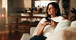 Smile, thinking and phone with woman on sofa in home for communication, social media and relax. Contact, online chat and connection with person and mobile in living room of apartment for vision