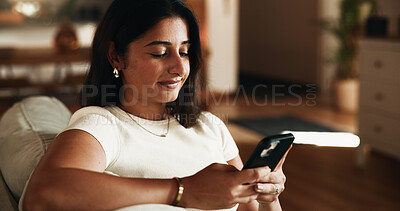 Buy stock photo Typing, reading and phone with woman on sofa in home for communication, social media and relax. Contact, online chat and connection with person and mobile in living room of apartment for app and post
