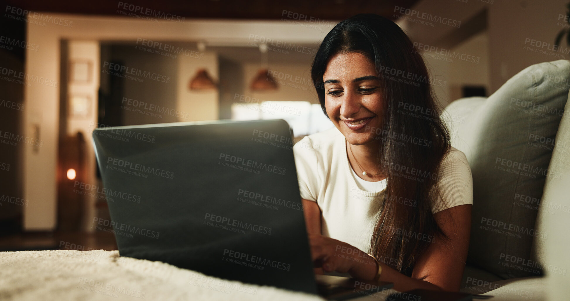 Buy stock photo Laptop, streaming and smile with woman on sofa in home for movie subscription, entertainment and calm. Film platform, weekend break and online show with female person in living room in apartment
