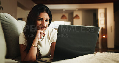 Buy stock photo Laptop, streaming and relax with woman on sofa in home for movie subscription, entertainment and calm. Film platform, weekend break and online show with female person in living room in apartment