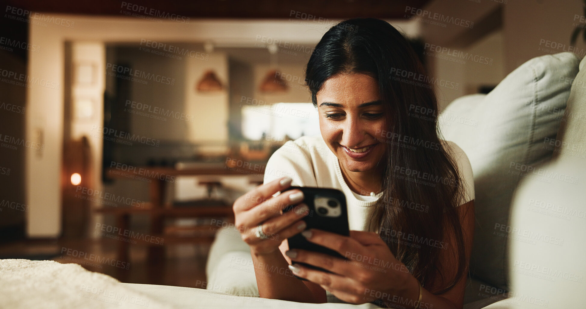 Buy stock photo Relax, reading and phone with woman on sofa in home for communication, social media and smile. Contact, online chat and connection with person and mobile in living room of apartment for app and post