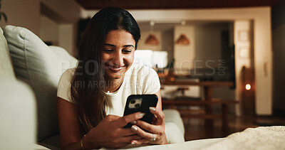 Buy stock photo Smile, relax and phone with woman on sofa in home for communication, social media and reading. Contact, online chat and connection with person and mobile in living room of apartment for app and post