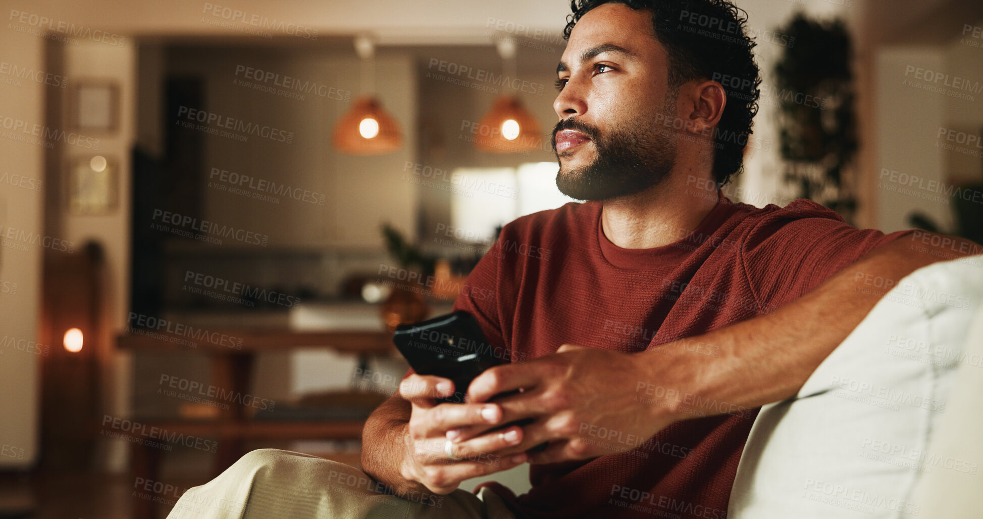 Buy stock photo Phone, relax and thinking with man on sofa in home for communication, social media and contact. Virtual chat, connection and networking app with person in apartment for news, update and idea