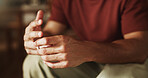 Man, hands or wedding ring for divorce in home, trust issues or infidelity suspicious for uncertainty. Relationship crisis, cheating fear or person with marriage problem, worry or separation choice