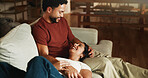 Happy couple, relax and laugh on sofa with bonding, care and connection with funny story in living room. People, partner and relationship with comfort, chill and attention with trust at apartment
