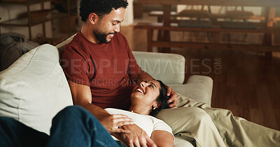 Buy stock photo Happy couple, relax and laugh on sofa with bonding, care and connection with funny story in home. People, partner and relationship with comfort, loyalty and attention with trust on couch at apartment