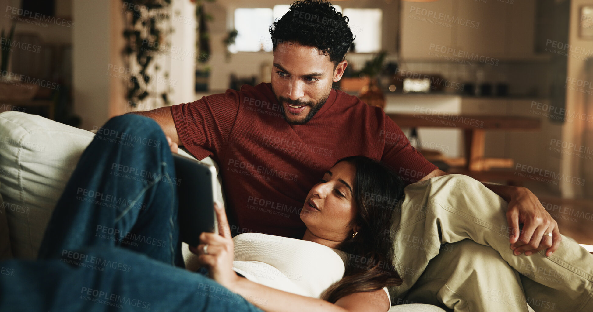 Buy stock photo Happy couple, relax and tablet on couch with bonding, meme and connection with video on web at house. People, partner and relationship with tech, application and film streaming on sofa in living room
