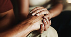 Love, couple and holding hands for trust, support and connection with partner in home together. Care, man and comfort woman with empathy, compassion and kindness for healthy relationship in marriage