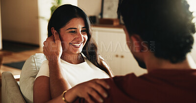 Buy stock photo Love, couple and woman with smile on couch for bonding, admiration and trust for healthy relationship. Security, partner support or happy people with romantic moment for connection, affection or home