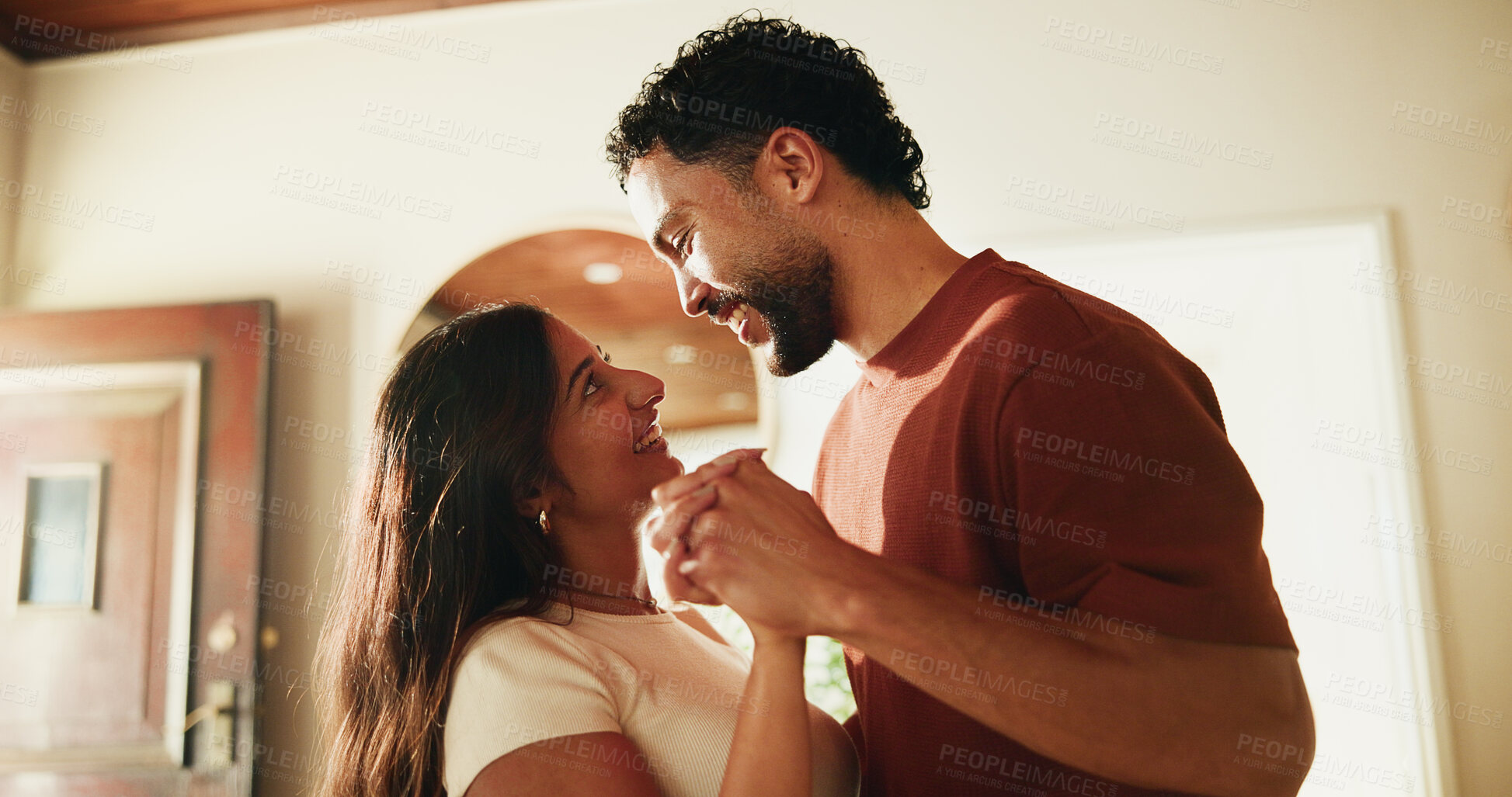 Buy stock photo Couple, smile and holding hands in home with dance, support partner and bonding together on weekend. Happy, people and rhythm in house with music, loyalty and love connection for marriage commitment.