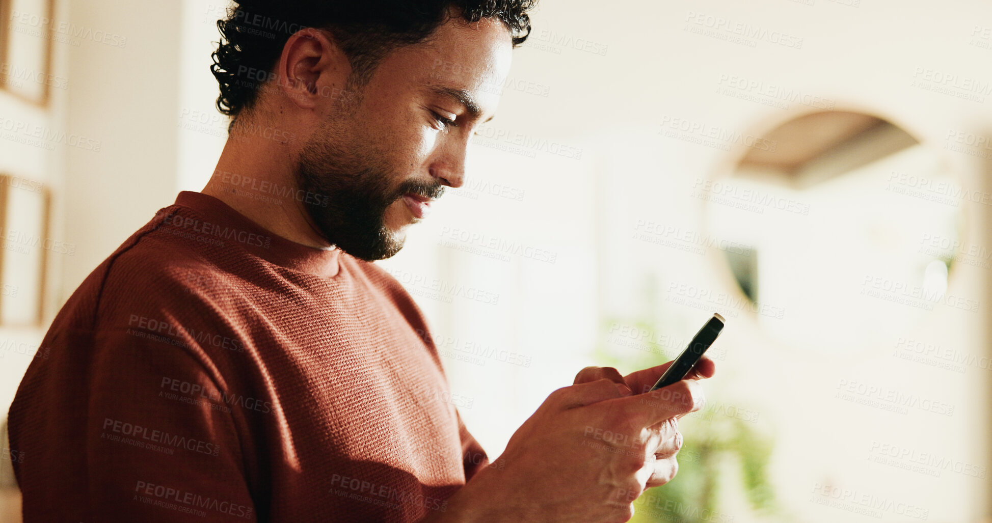 Buy stock photo Phone, relax and texting with man in home for communication, social media and contact. Virtual chat, connection and networking app with male person in apartment for news, update and online post